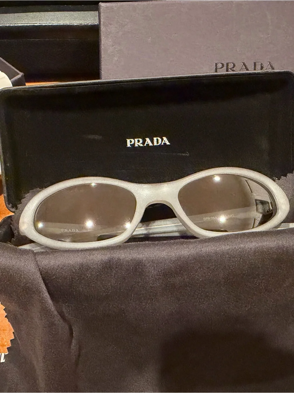Prada Kids Oval Sunglasses in Light Gray with Dark Lenses